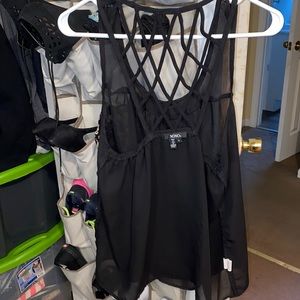 Sheer black top with decal back.